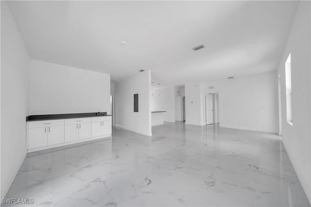 4646 Leonard Blvd S, Lehigh Acres, FL 33973 - unfurnished room featuring light marble finish flooring and baseboards