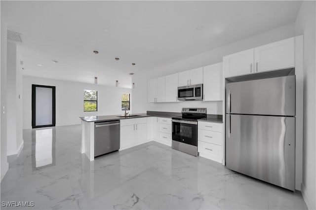 4646 Leonard Blvd S, Lehigh Acres, FL 33973 - kitchen featuring stainless steel appliances, white cabinetry, light marble finish floors, a sink, and open floor plan
