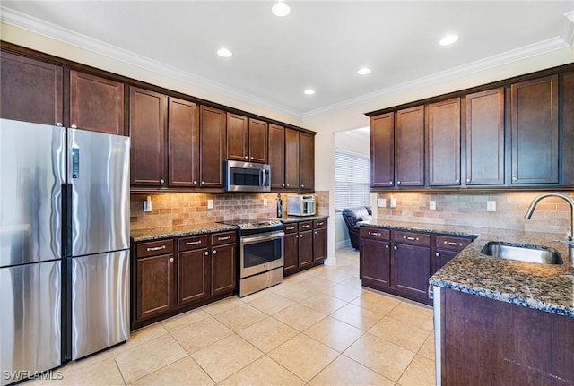 11221 Yellow Poplar Dr, Fort Myers, FL 33913 - kitchen featuring dark stone counters, dark brown cabinets, a sink, light tile patterned flooring, and appliances with stainless steel finishes