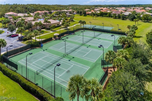 11221 Yellow Poplar Dr, Fort Myers, FL 33913 - view of tennis court featuring a residential view and fence