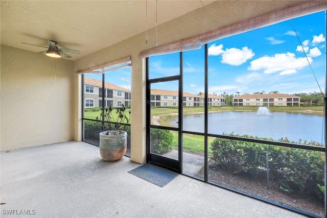 18911 Bay Woods Lake Dr Unit 102, Fort Myers, FL 33908 - unfurnished sunroom featuring a textured wall and a water view