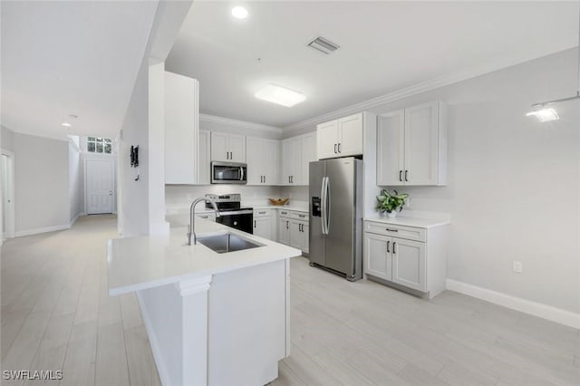 18911 Bay Woods Lake Dr Unit 102, Fort Myers, FL 33908 - kitchen featuring appliances with stainless steel finishes, a sink, light countertops, a peninsula, and recessed lighting