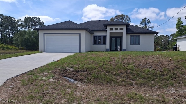 3501 70th St W, Lehigh Acres, FL 33971 - prairie-style home with a garage, roof with shingles, stucco siding, and concrete driveway