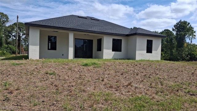 3501 70th St W, Lehigh Acres, FL 33971 - rear view of property with roof with shingles and stucco siding