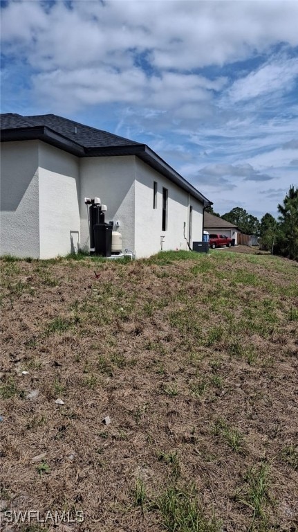 3501 70th St W, Lehigh Acres, FL 33971 - view of property exterior featuring stucco siding