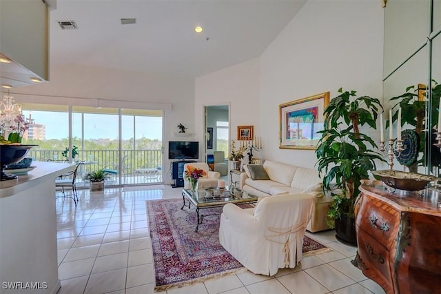 281 Lenell Rd Unit 1 7-A, Fort Myers Beach, FL 33931 - living room featuring light tile patterned flooring, visible vents, and high vaulted ceiling