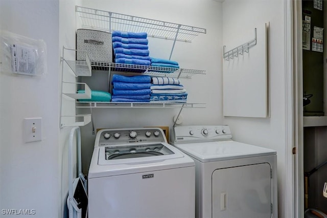 281 Lenell Rd Unit 1 7-A, Fort Myers Beach, FL 33931 - laundry area with washing machine and clothes dryer and laundry area