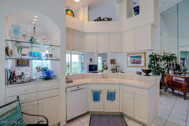 281 Lenell Rd Unit 1 7-A, Fort Myers Beach, FL 33931 - kitchen with light countertops, dishwasher, a sink, a peninsula, and light tile patterned flooring