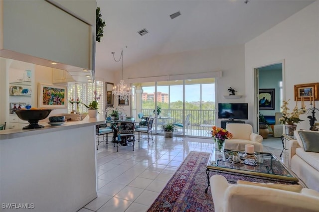 281 Lenell Rd Unit 1 7-A, Fort Myers Beach, FL 33931 - living area with visible vents, high vaulted ceiling, an inviting chandelier, and light tile patterned flooring