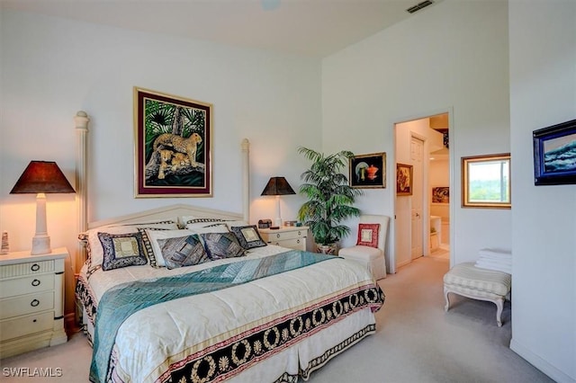 281 Lenell Rd Unit 1 7-A, Fort Myers Beach, FL 33931 - bedroom with light colored carpet, visible vents, and ensuite bath