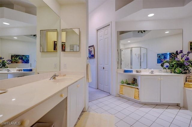 281 Lenell Rd Unit 1 7-A, Fort Myers Beach, FL 33931 - bathroom with a stall shower, tile patterned flooring, a sink, and two vanities