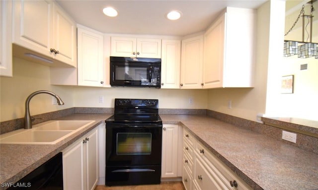 kitchen featuring white cabinets, recessed lighting, a sink, and black appliances
