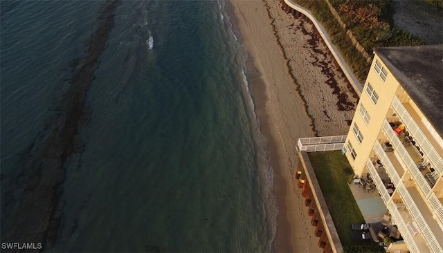 bird's eye view featuring a view of the beach and a water view