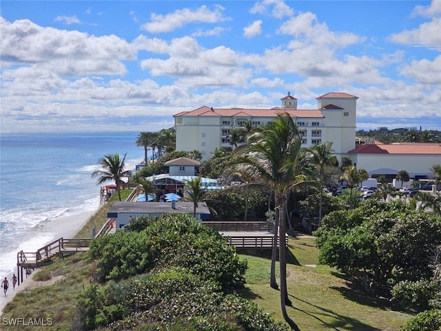 water view with a view of the beach and fence