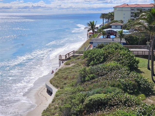 exterior space featuring fence and a view of the beach