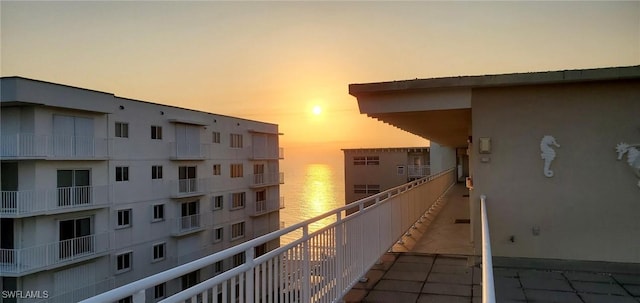 view of balcony at dusk