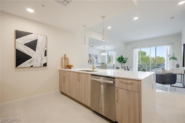 kitchen with light brown cabinetry, dishwasher, visible vents, a peninsula, and open floor plan