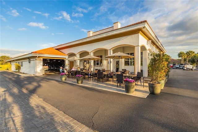 view of property's community with outdoor dining area