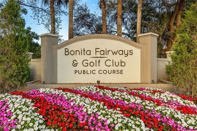 community sign featuring fence