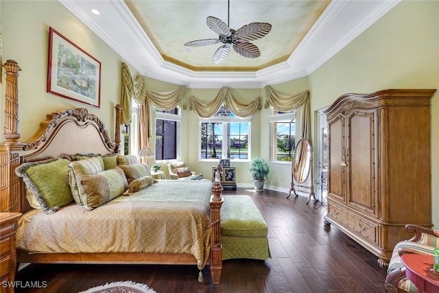 8993 Crooked Stick Ct, Naples, FL 34113 - bedroom with a raised ceiling, ornamental molding, baseboards, and dark wood finished floors