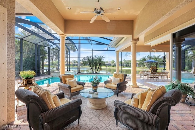 8993 Crooked Stick Ct, Naples, FL 34113 - view of patio with a lanai, outdoor lounge area, a ceiling fan, and an outdoor pool