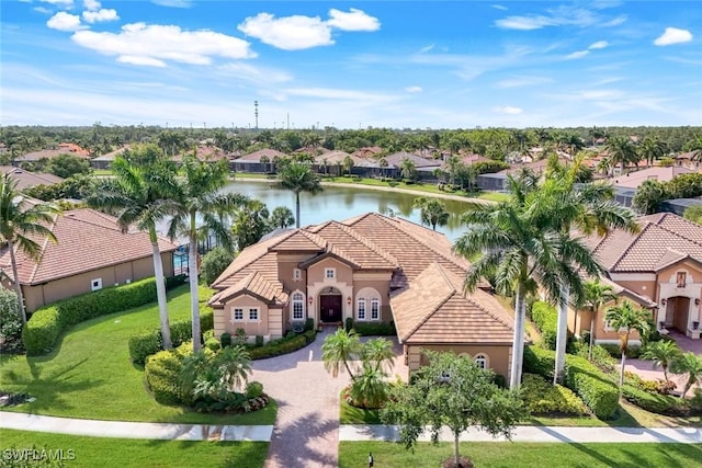 8993 Crooked Stick Ct, Naples, FL 34113 - view of front of property featuring a residential view, stucco siding, a water view, and a tile roof