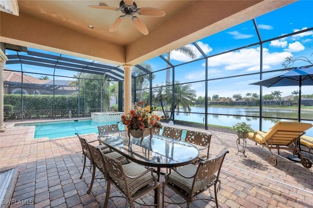 8993 Crooked Stick Ct, Naples, FL 34113 - exterior space with a ceiling fan, a swimming pool, a water view, and outdoor dining space
