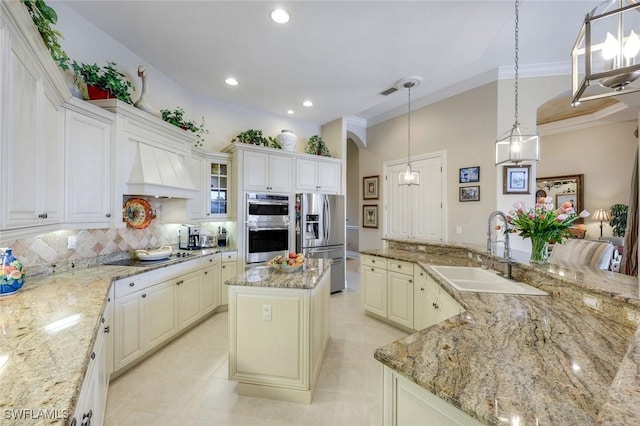 8993 Crooked Stick Ct, Naples, FL 34113 - kitchen with decorative backsplash, a spacious island, a sink, custom exhaust hood, and stainless steel appliances