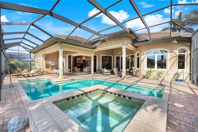 8993 Crooked Stick Ct, Naples, FL 34113 - back of house with a patio, a ceiling fan, an outdoor hangout area, and stucco siding