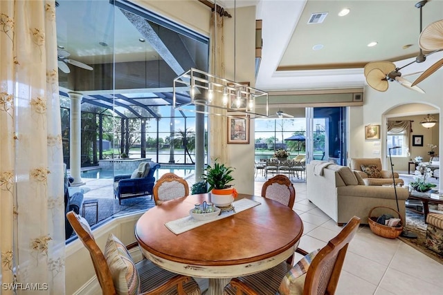 8993 Crooked Stick Ct, Naples, FL 34113 - dining room featuring visible vents, recessed lighting, arched walkways, tile patterned floors, and a ceiling fan