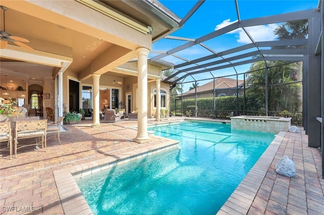 8993 Crooked Stick Ct, Naples, FL 34113 - view of swimming pool with ceiling fan, a patio area, and glass enclosure