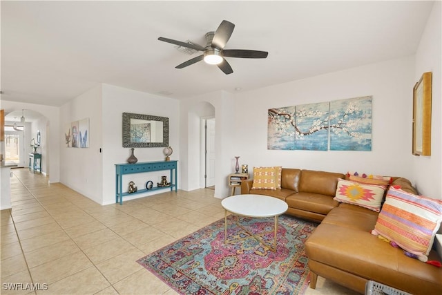 618 SW 18th St, Cape Coral, FL 33991 - living area with light tile patterned flooring, arched walkways, and a ceiling fan