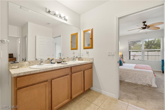 618 SW 18th St, Cape Coral, FL 33991 - ensuite bathroom with connected bathroom, baseboards, and a sink