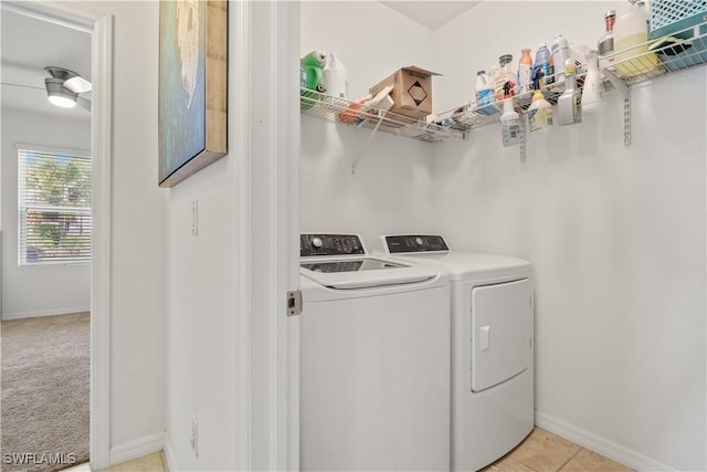 618 SW 18th St, Cape Coral, FL 33991 - clothes washing area with light tile patterned floors, separate washer and dryer, laundry area, and baseboards