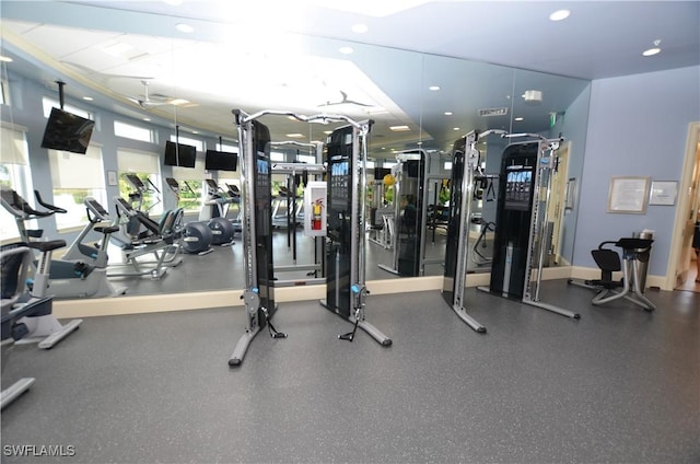 exercise room featuring recessed lighting and baseboards