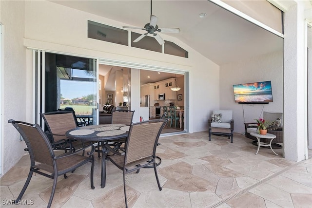 view of patio / terrace with outdoor dining area and a ceiling fan