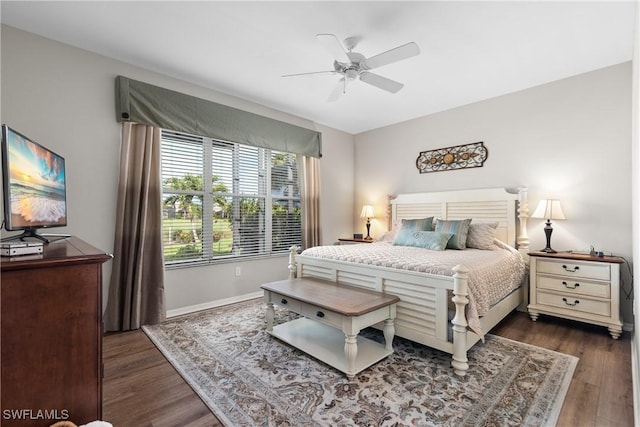 bedroom featuring baseboards, a ceiling fan, and wood finished floors