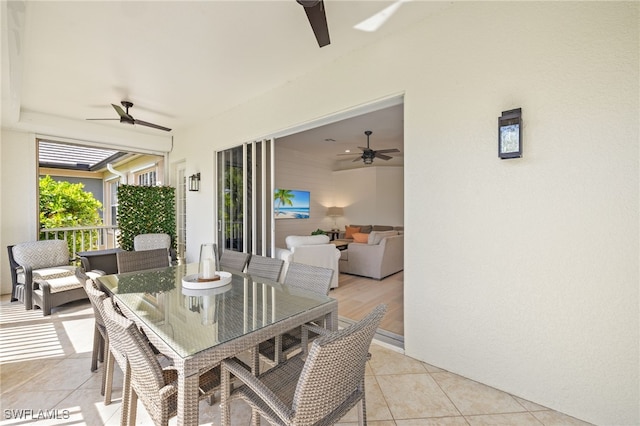 view of patio / terrace featuring outdoor dining area and a ceiling fan