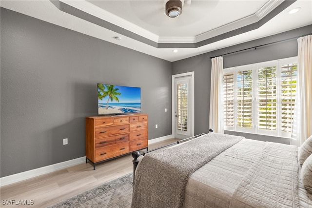 bedroom with access to outside, a raised ceiling, light wood-style flooring, recessed lighting, and ornamental molding