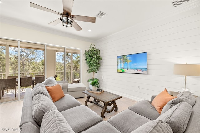 living room featuring a ceiling fan, visible vents, recessed lighting, and light wood-style floors