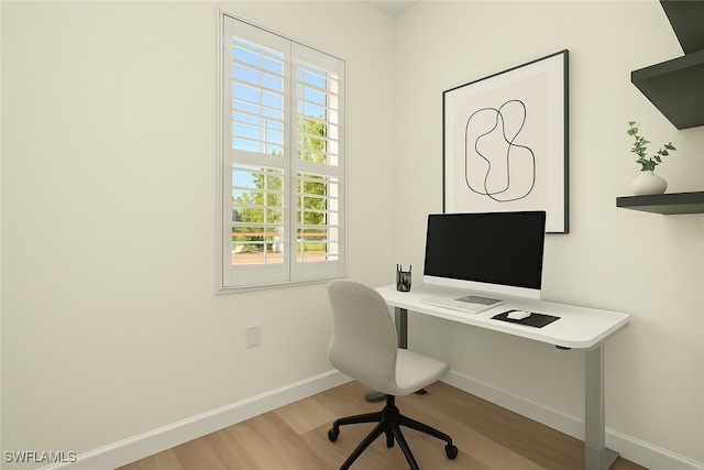 office area featuring baseboards and wood finished floors