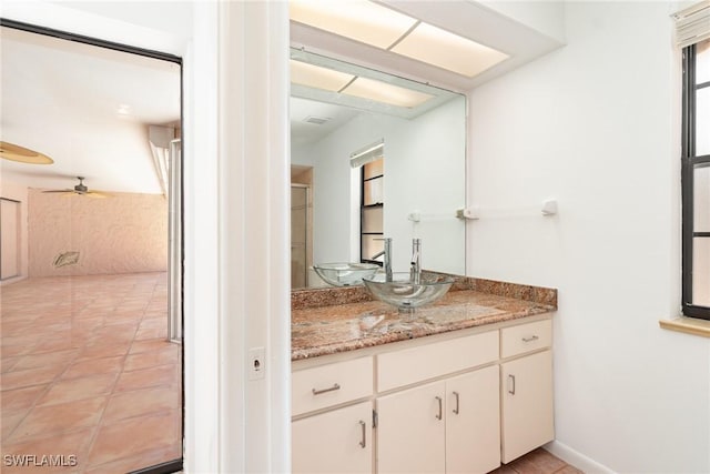 bathroom featuring a ceiling fan, vanity, and tile patterned floors