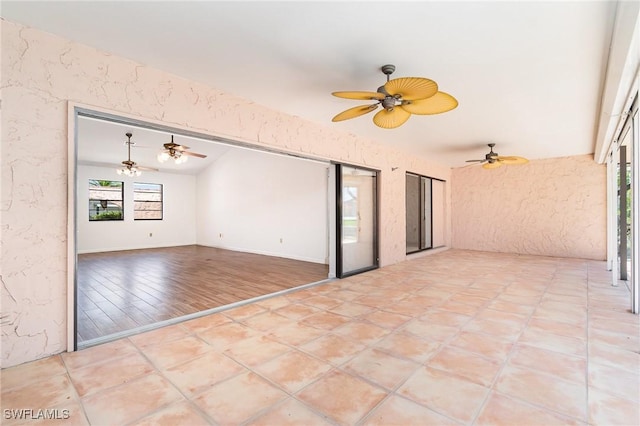 view of patio featuring ceiling fan