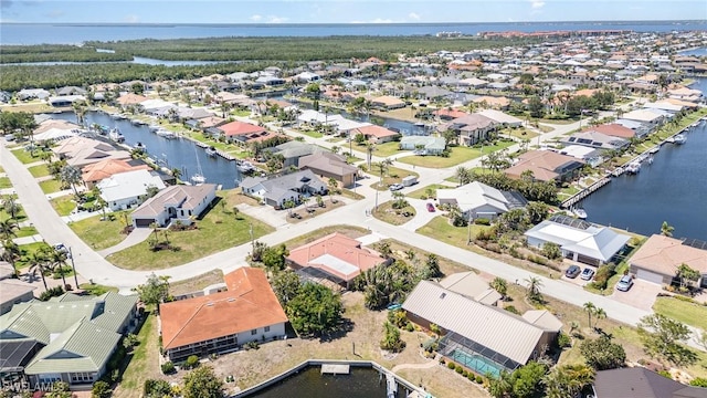 bird's eye view with a water view and a residential view