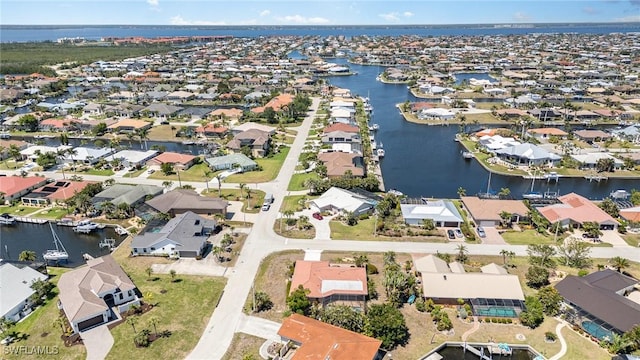 bird's eye view with a water view and a residential view