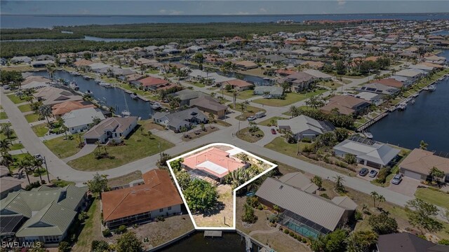 aerial view featuring a residential view and a water view