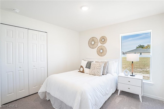 506 NW 21st St, Cape Coral, FL 33993 - bedroom featuring carpet, a closet, and baseboards