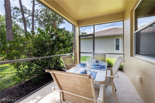 sunroom / solarium with outdoor dining area
