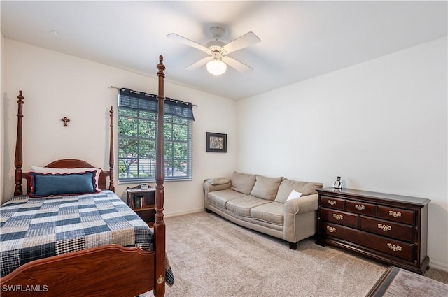 carpeted bedroom with baseboards and ceiling fan