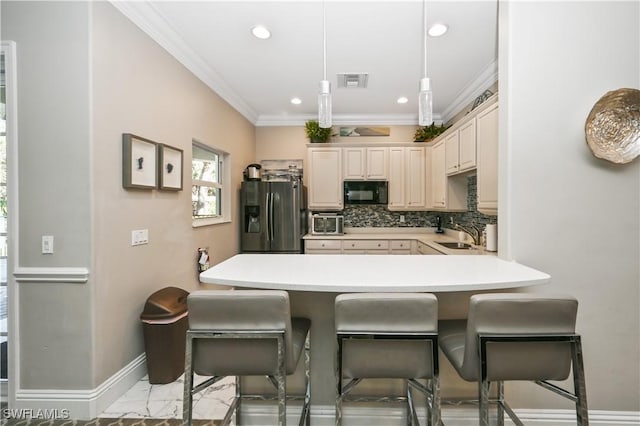 kitchen with ornamental molding, a peninsula, black microwave, a breakfast bar, and stainless steel fridge with ice dispenser